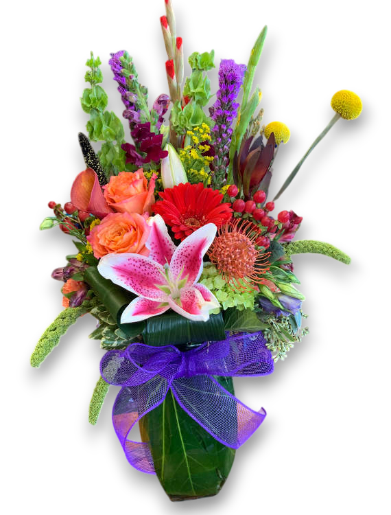 Colorful flower arrangement with a purple ribbon on a white background
